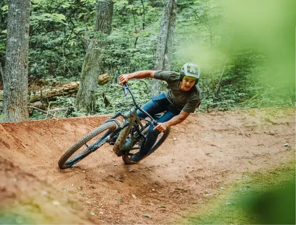Man biking on dirt trail at WildSide park