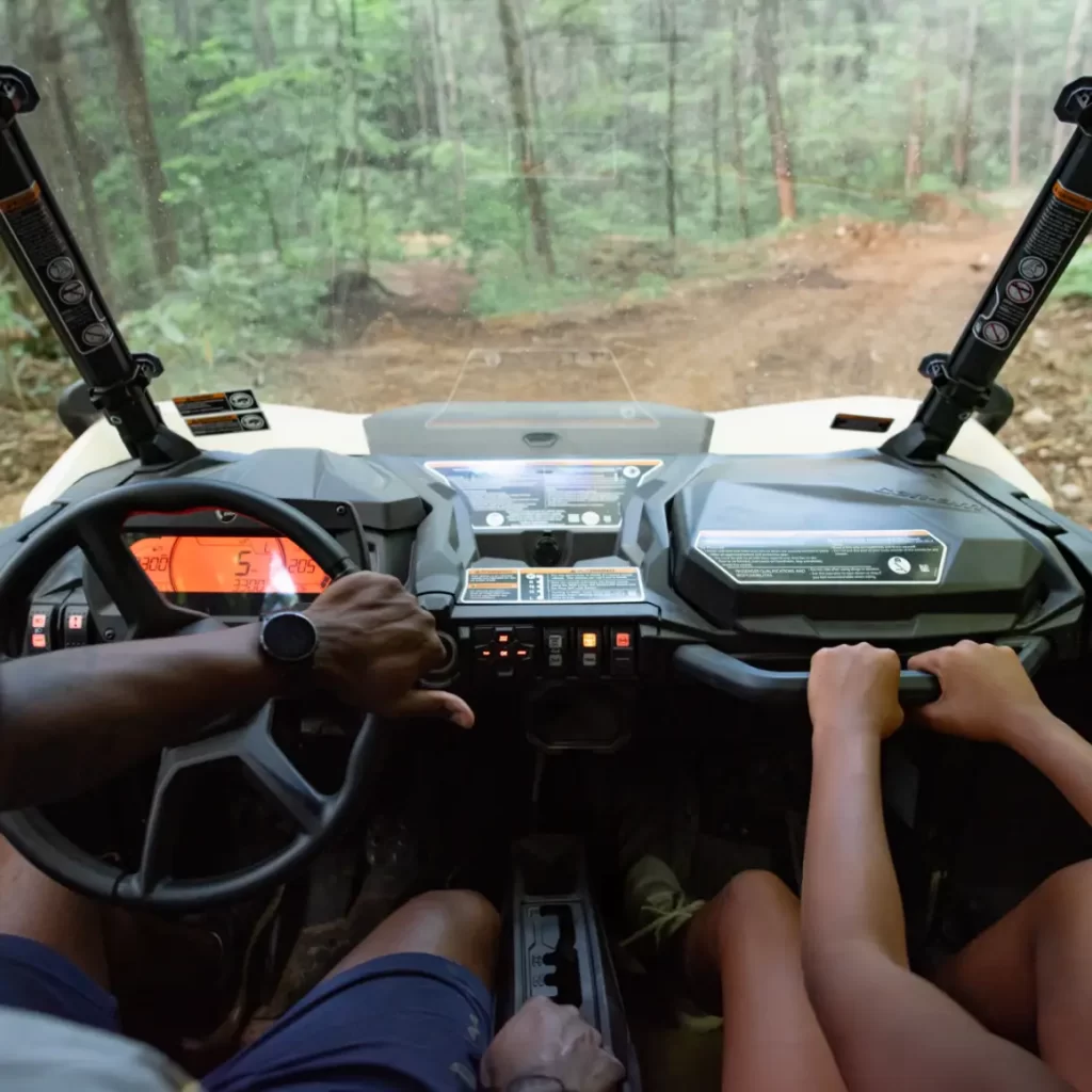 Visitor to The Park from WildSide rides in UTV while on a UTV tour